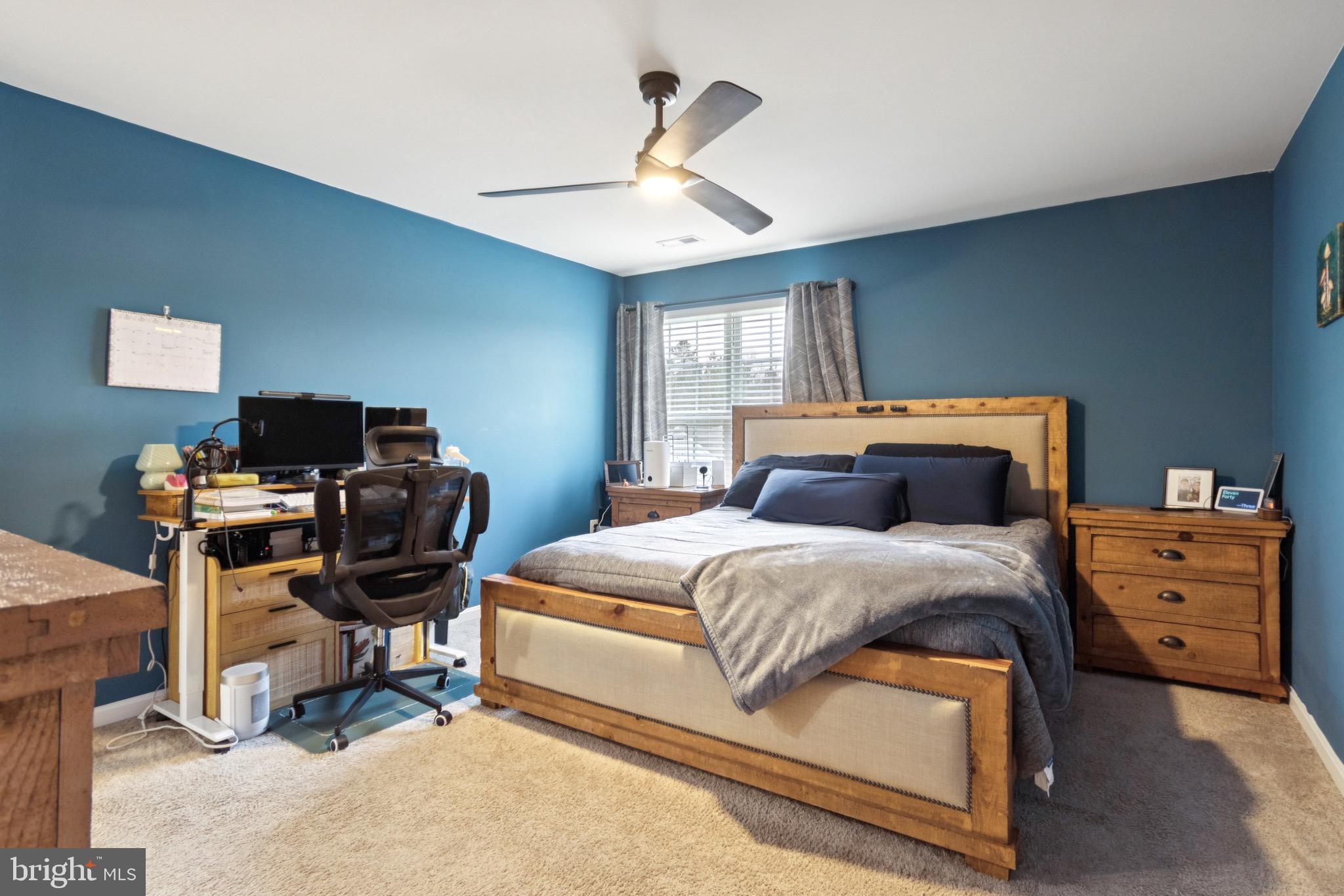 17063 Rollins Road Bowling Green, VA 22427 - Photo 21 of 40 a bedroom with a bed and a chair