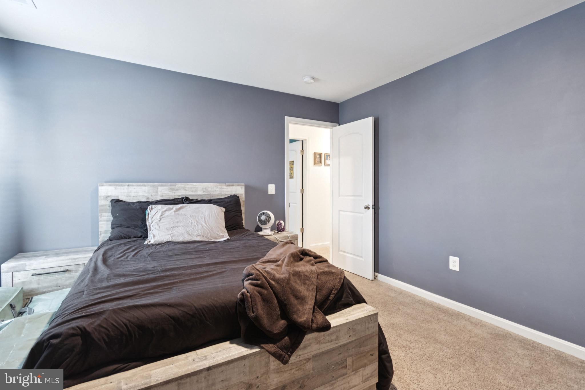 17063 Rollins Road Bowling Green, VA 22427 - Photo 31 of 40 a bedroom with a bed and a couch