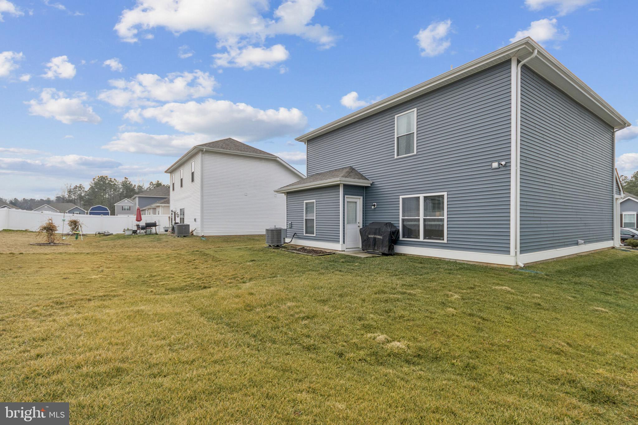 17063 Rollins Road Bowling Green, VA 22427 - Photo 38 of 40 a view of a house with a backyard