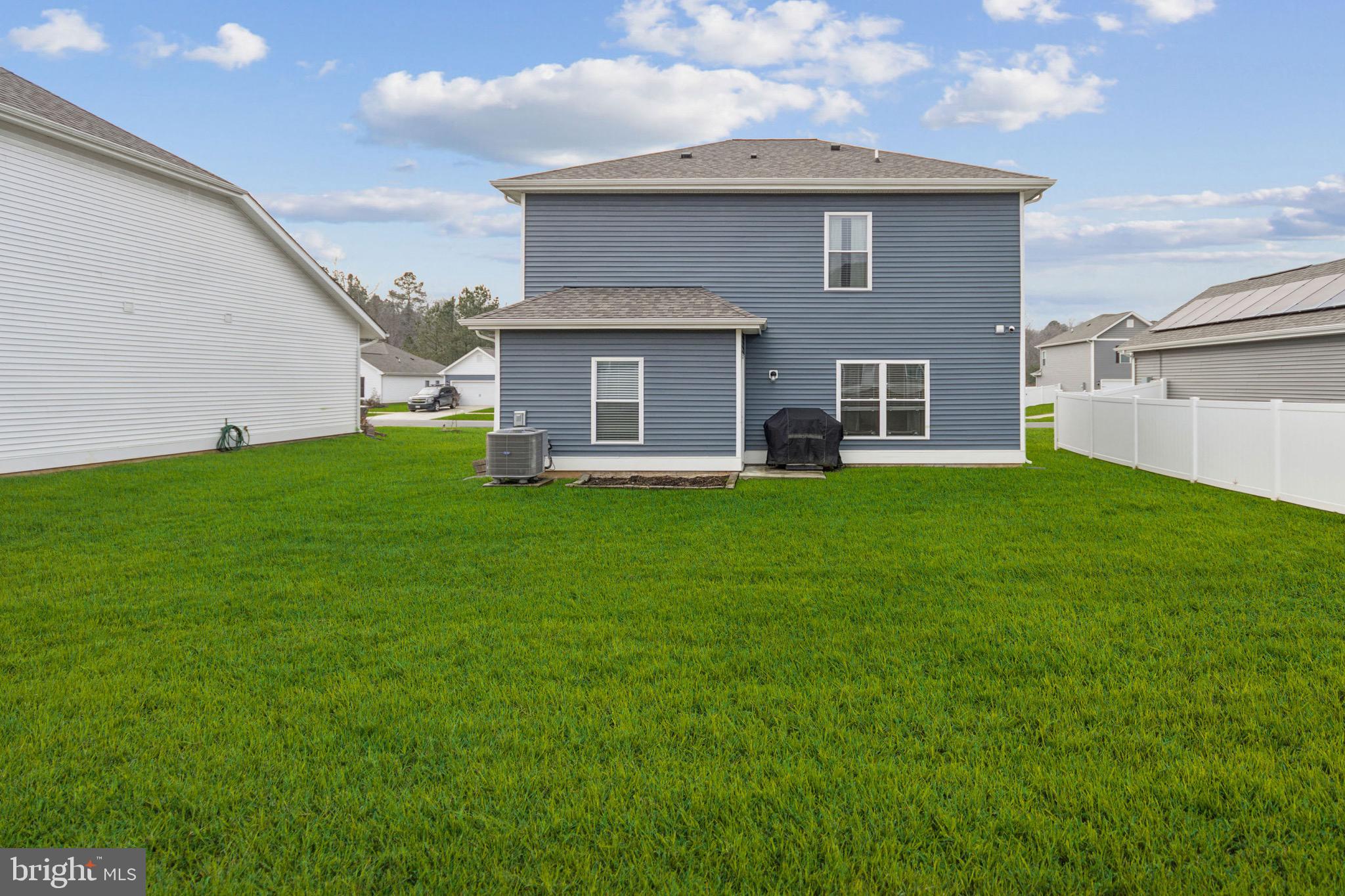 17063 Rollins Road Bowling Green, VA 22427 - Photo 39 of 40 a brick house with a yard