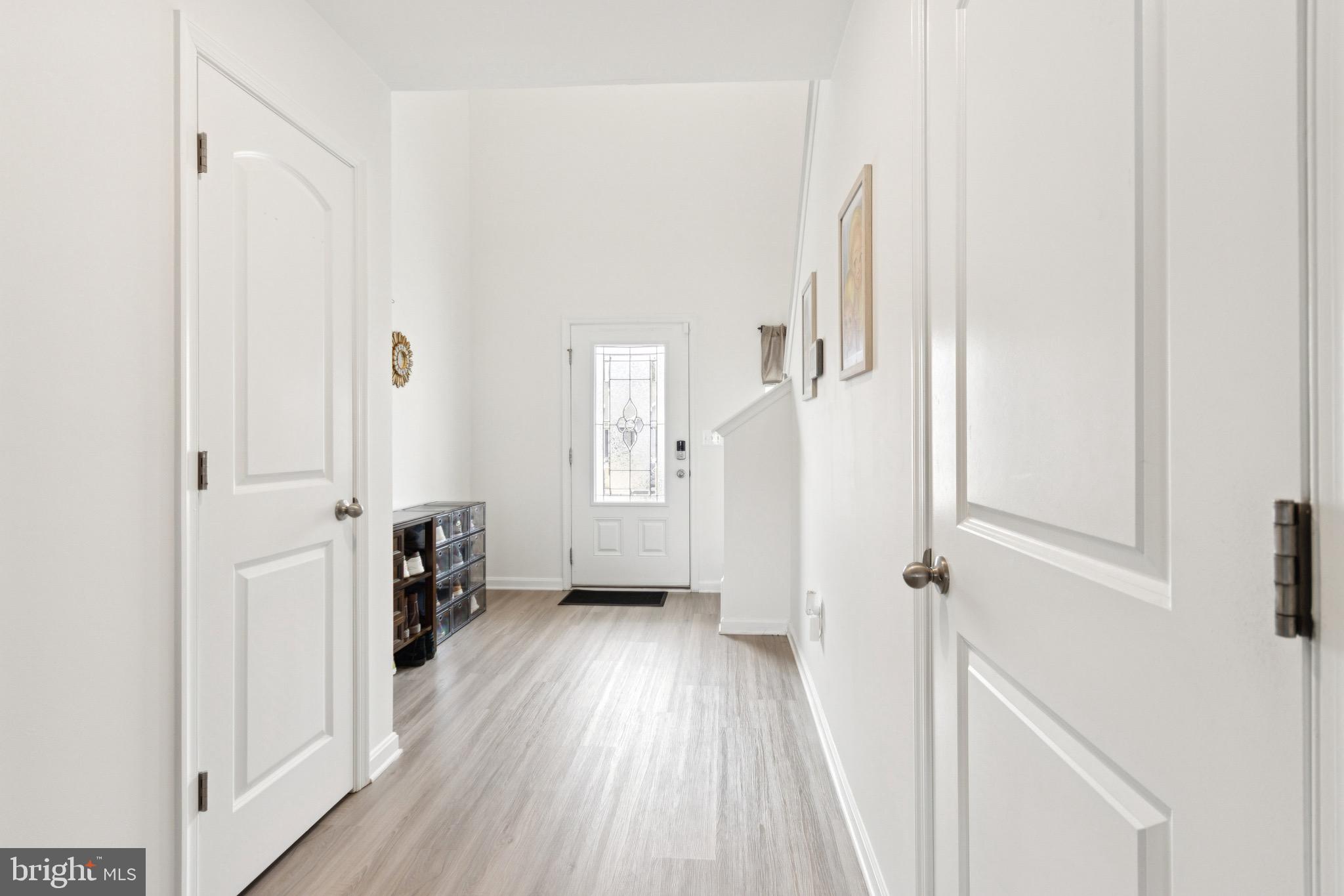 17063 Rollins Road Bowling Green, VA 22427 - Photo 8 of 40 a view of a hallway with wooden floor and staircase
