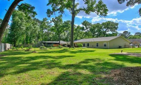a backyard of a house with barbeque oven