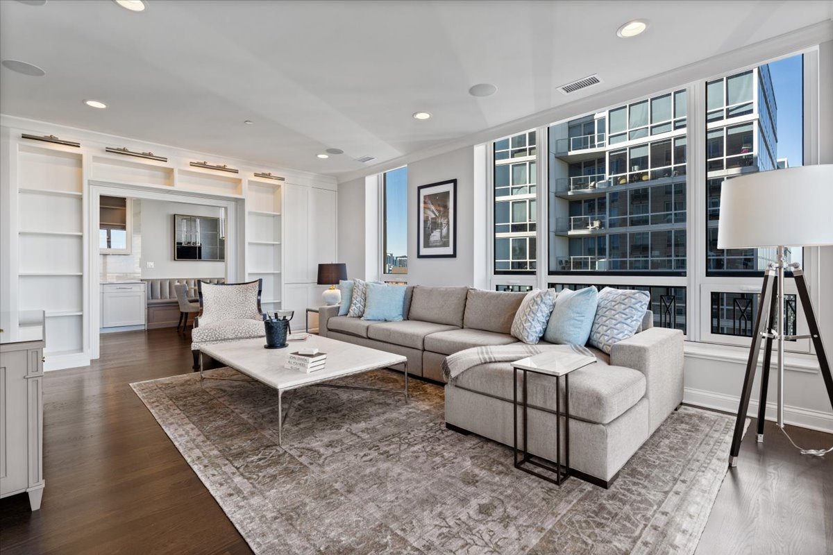 10 East Delaware Place, Unit 28E Chicago, IL 60611 - Photo 11 of 41 a living room with furniture and large window