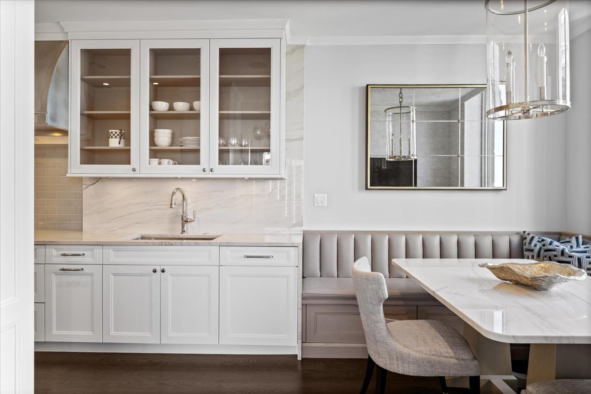 10 East Delaware Place, Unit 28E Chicago, IL 60611 - Photo 16 of 41 a view of a kitchen area with furniture and wooden floor