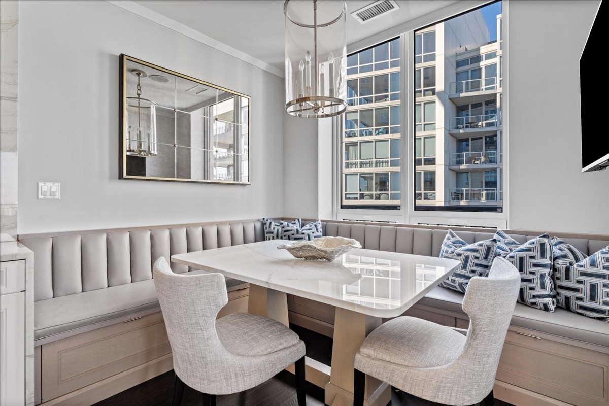 10 East Delaware Place, Unit 28E Chicago, IL 60611 - Photo 17 of 41 a view of a dining room with furniture window and outside view