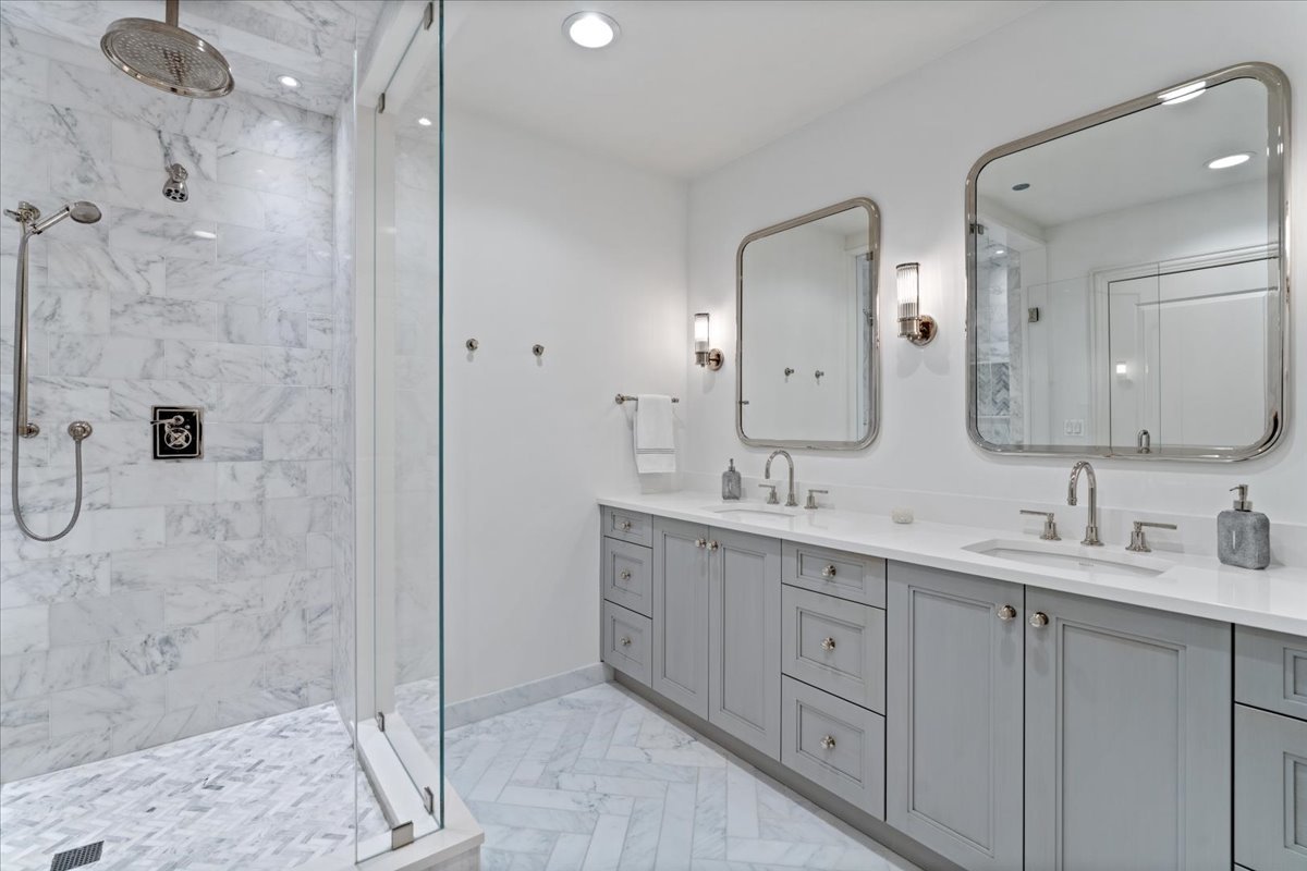 10 East Delaware Place, Unit 28E Chicago, IL 60611 - Photo 22 of 41 a bathroom with a double vanity sink mirror and double