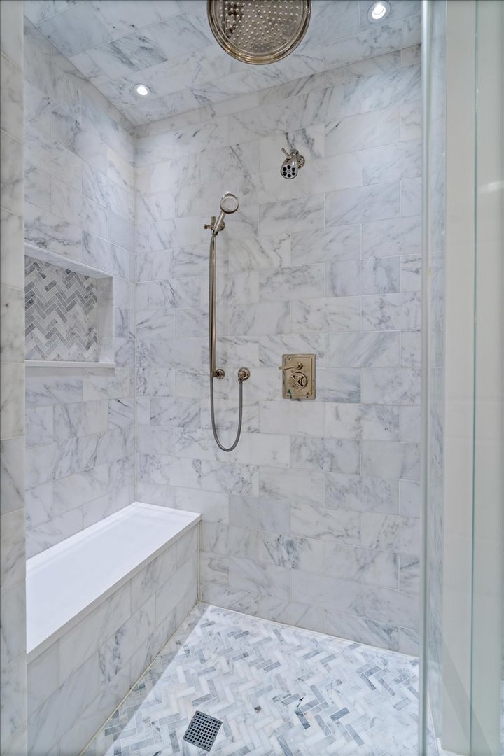 10 East Delaware Place, Unit 28E Chicago, IL 60611 - Photo 23 of 41 a bathroom with a shower