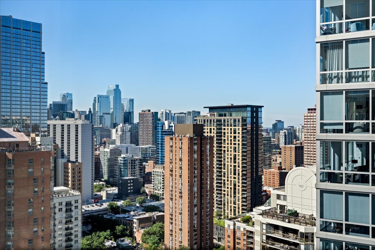 10 East Delaware Place, Unit 28E Chicago, IL 60611 - Photo 36 of 41 a city view with tall buildings