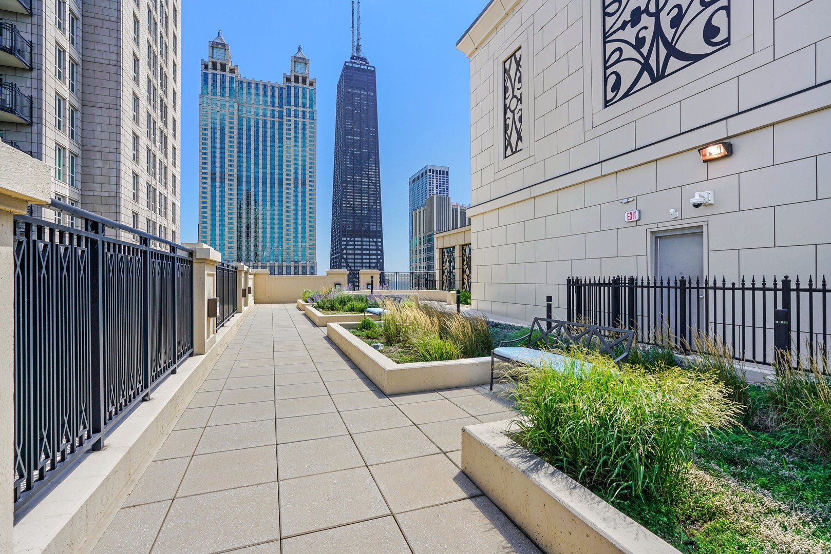 10 East Delaware Place, Unit 28E Chicago, IL 60611 - Photo 40 of 41 a view of a balcony with potted plants