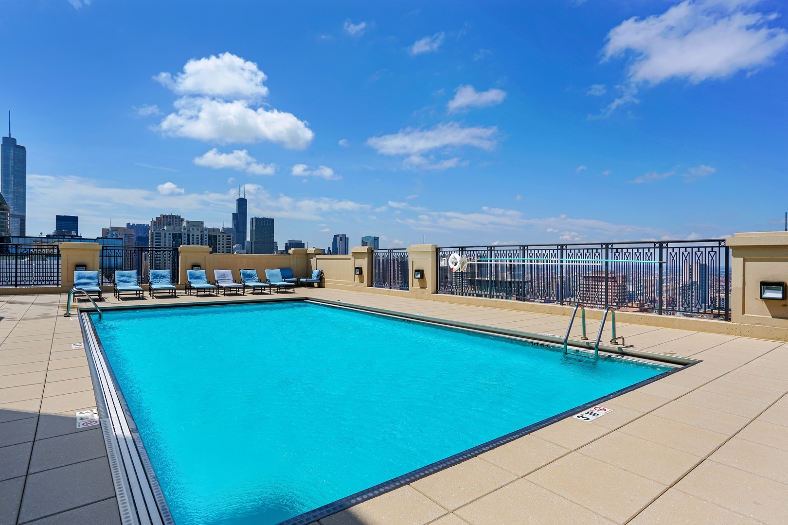 10 East Delaware Place, Unit 28E Chicago, IL 60611 - Photo 41 of 41 a view of a swimming pool and lounge chair