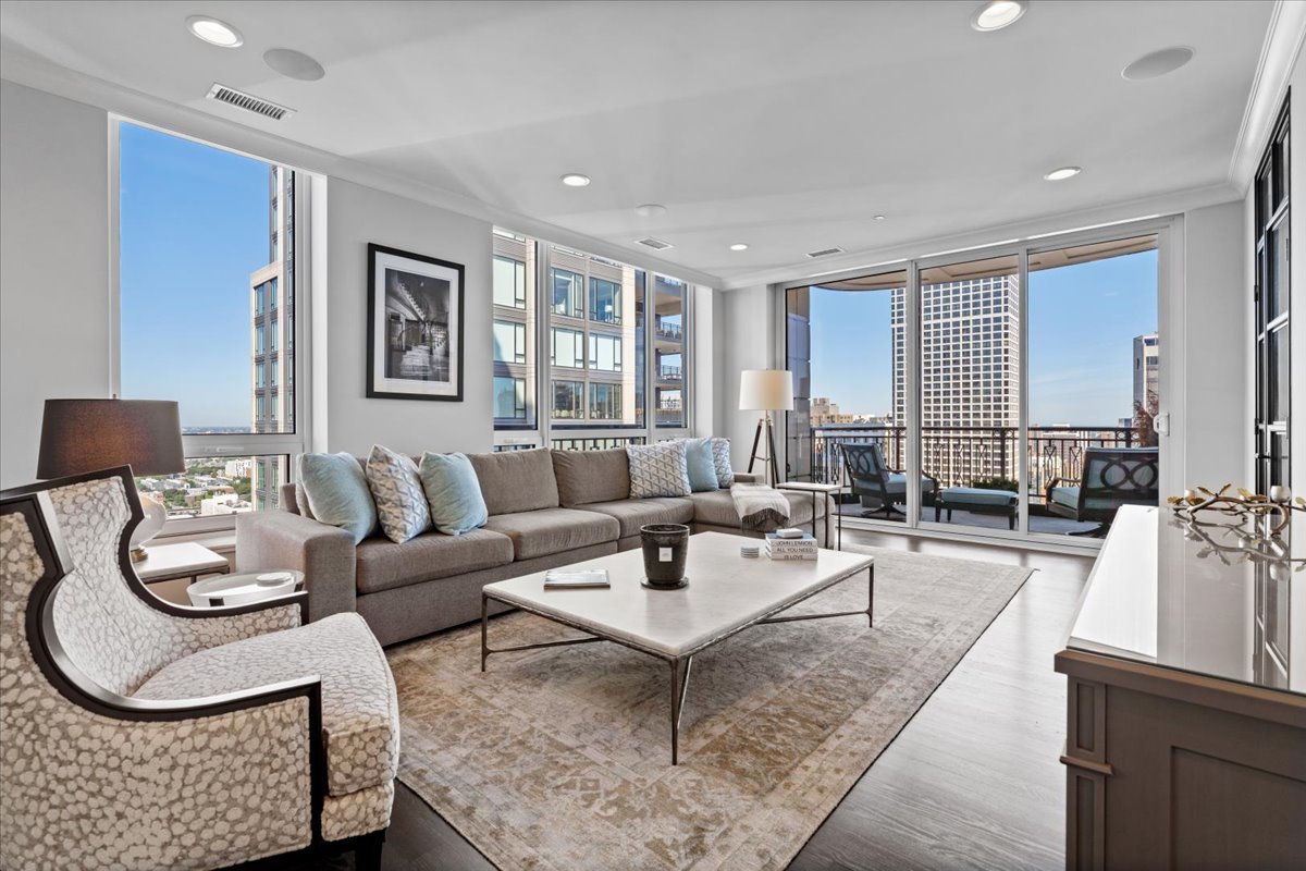 10 East Delaware Place, Unit 28E Chicago, IL 60611 - Photo 5 of 41 a living room with furniture and wooden floor