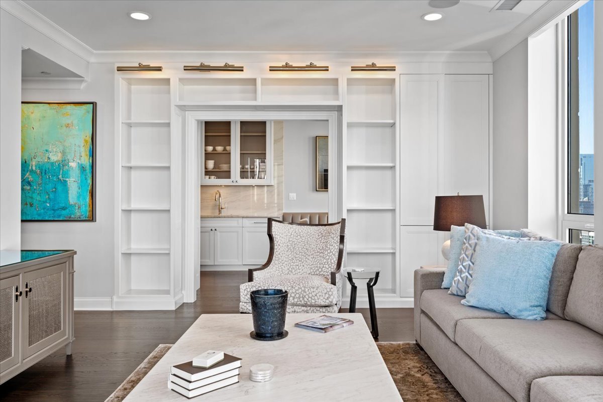 10 East Delaware Place, Unit 28E Chicago, IL 60611 - Photo 8 of 41 a living room with furniture a window and a dining table