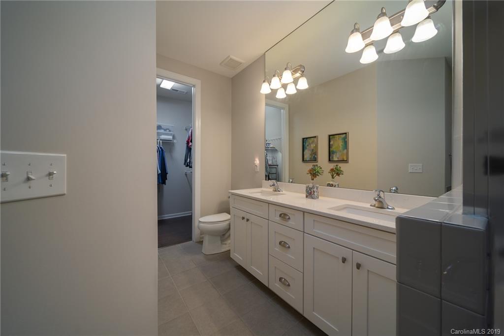 1002 Archibald Avenue Fort Mill, SC 29708 - Photo 18 of 26 a bathroom with a double vanity sink and a mirror
