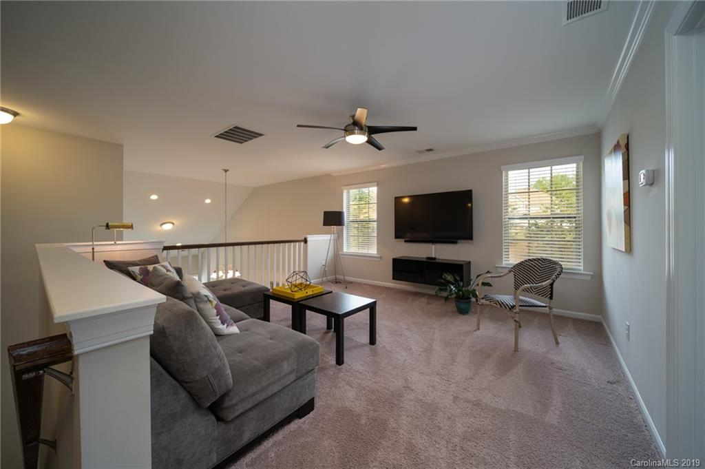 1002 Archibald Avenue Fort Mill, SC 29708 - Photo 20 of 26 a living room with furniture and a flat screen tv