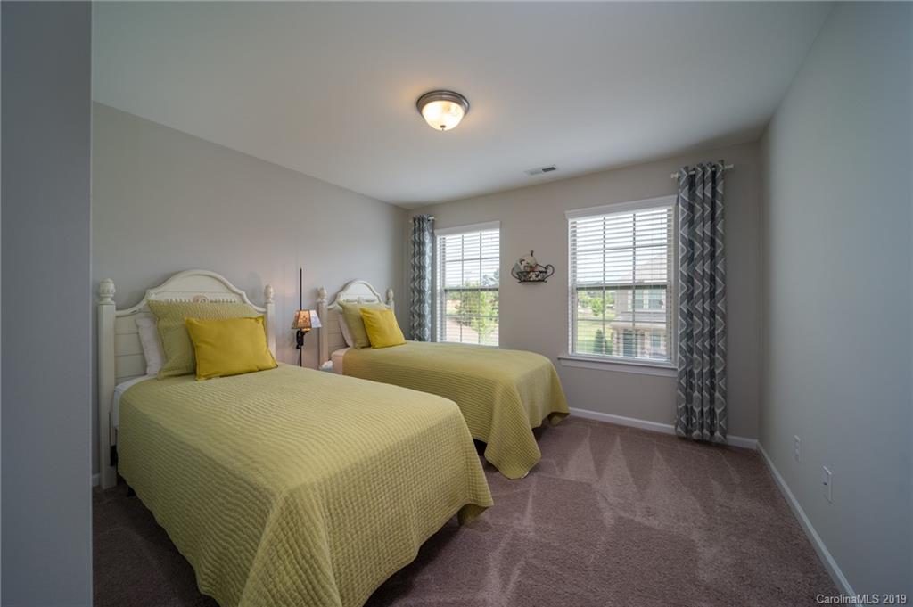 1002 Archibald Avenue Fort Mill, SC 29708 - Photo 24 of 26 a spacious bedroom with two beds and a window