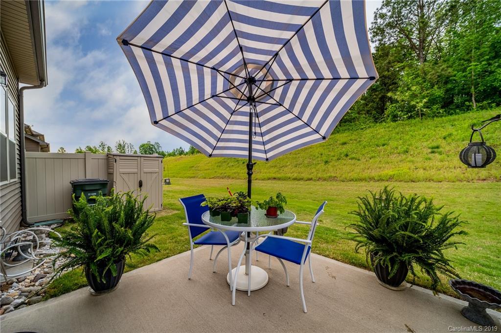 1002 Archibald Avenue Fort Mill, SC 29708 - Photo 25 of 26 a view of a backyard with plants and patio