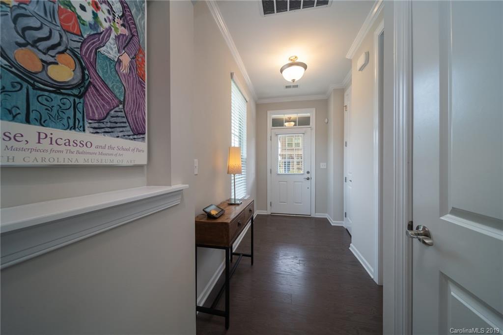 1002 Archibald Avenue Fort Mill, SC 29708 - Photo 5 of 26 wooden floor in a hall with a window