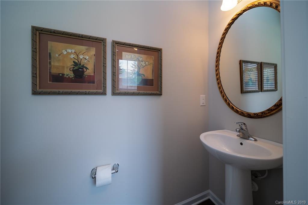 1002 Archibald Avenue Fort Mill, SC 29708 - Photo 7 of 26 a bathroom with a sink and a mirror