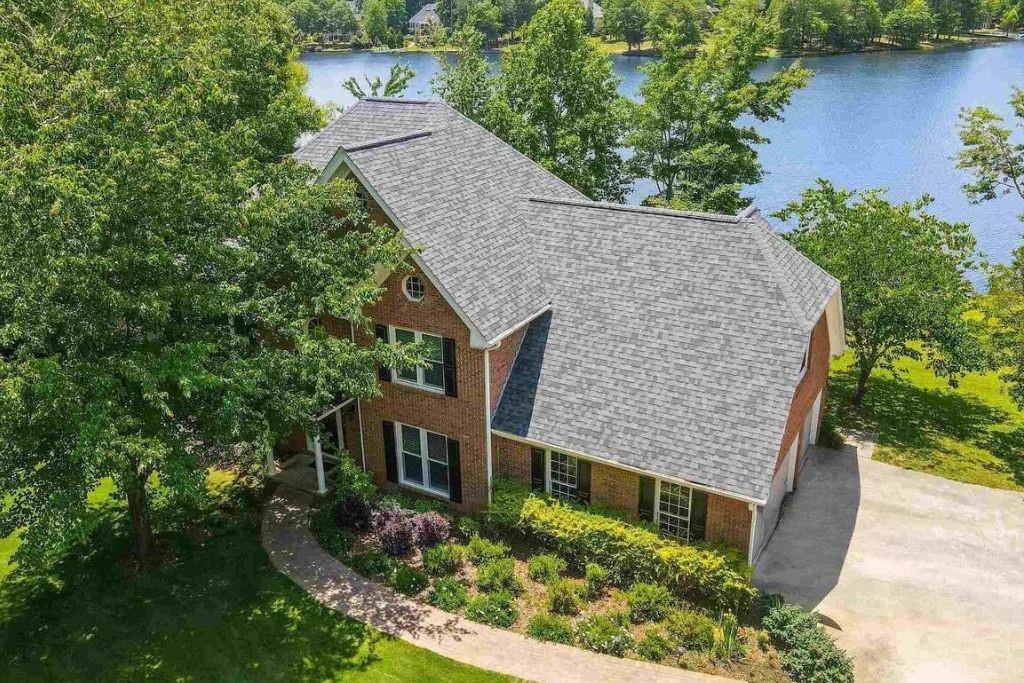 an aerial view of a house with a yard and potted plants