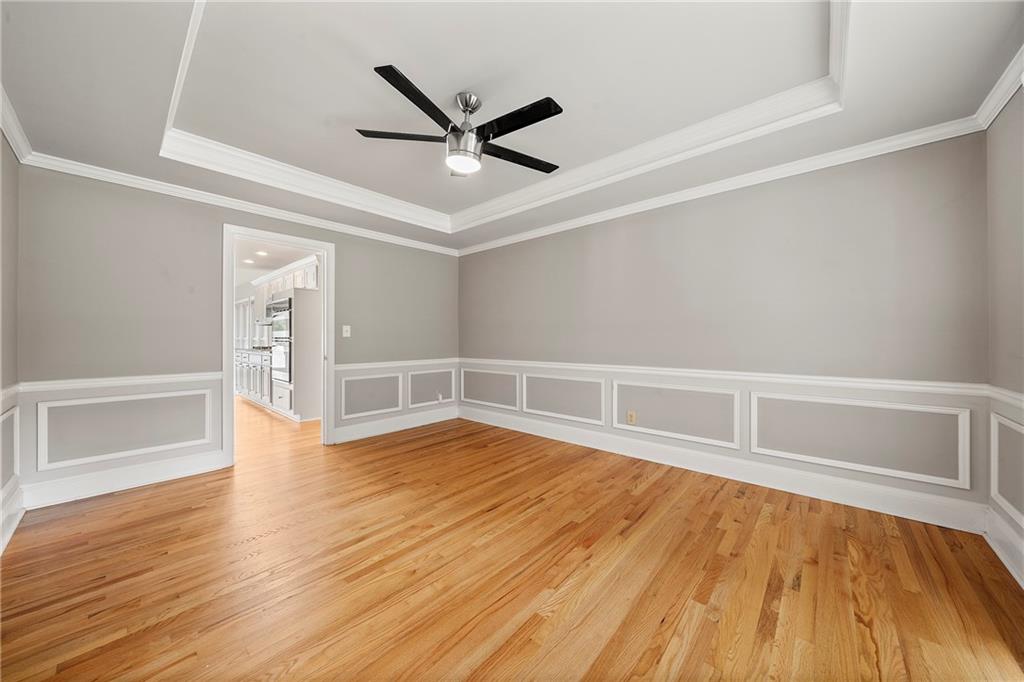 75 Spring Ridge Court Newnan, GA 30265 - Photo 26 of 75 wooden floor in an empty room with a window