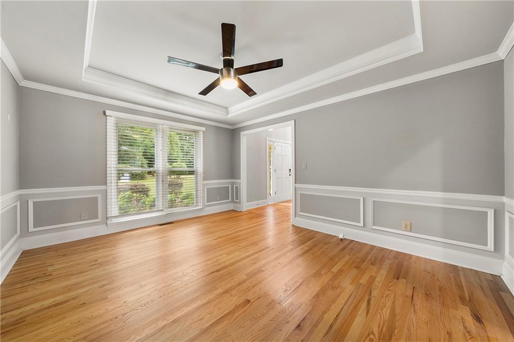 75 Spring Ridge Court Newnan, GA 30265 - Photo 27 of 75 wooden floor in an empty room with a window