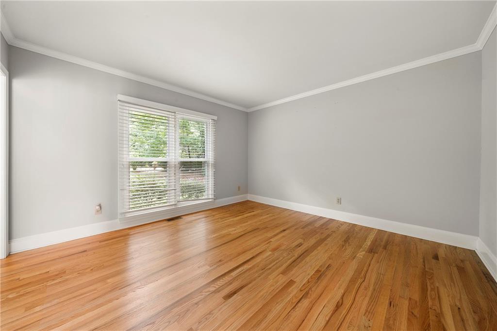 75 Spring Ridge Court Newnan, GA 30265 - Photo 30 of 75 a view of an empty room with wooden floor and a window