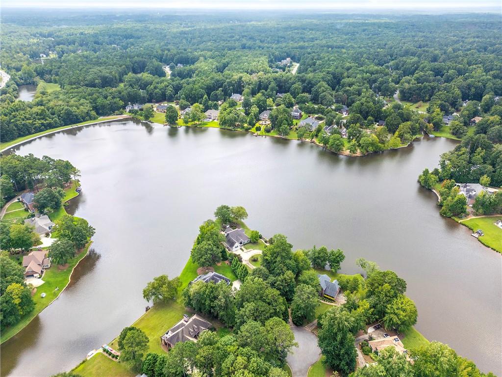 75 Spring Ridge Court Newnan, GA 30265 - Photo 3 of 75 an aerial view of lake residential house with outdoor space and trees around