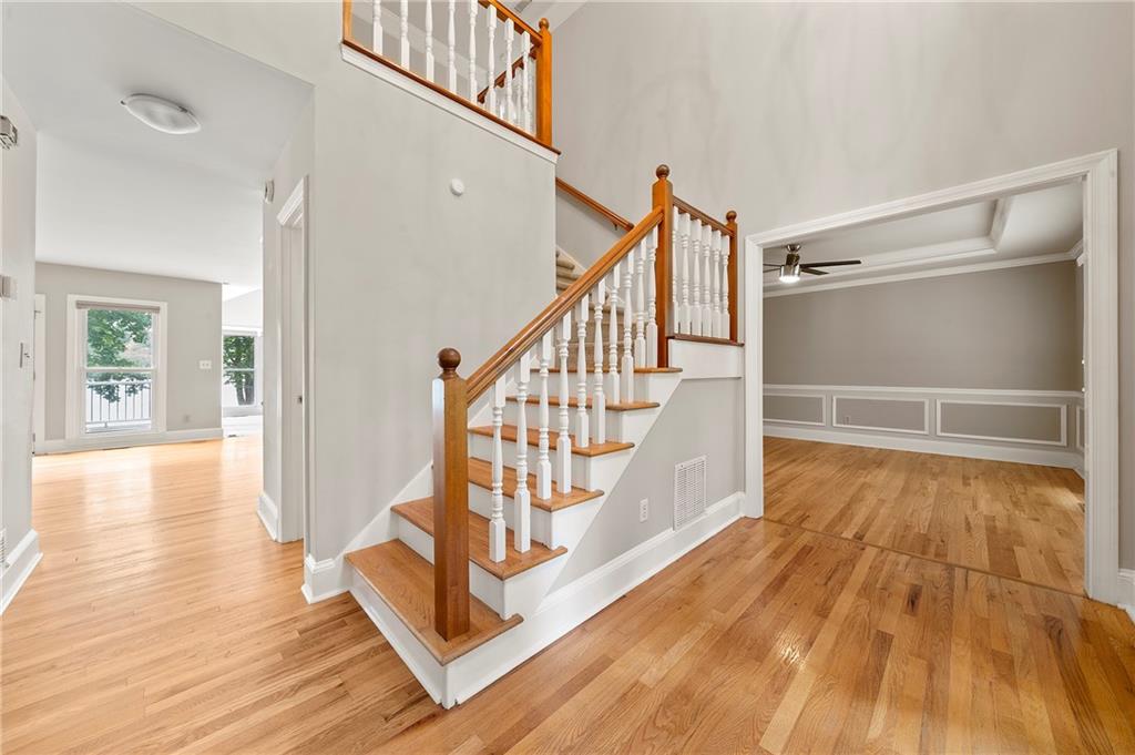 75 Spring Ridge Court Newnan, GA 30265 - Photo 32 of 75 a view of entryway with wooden floor and stairs