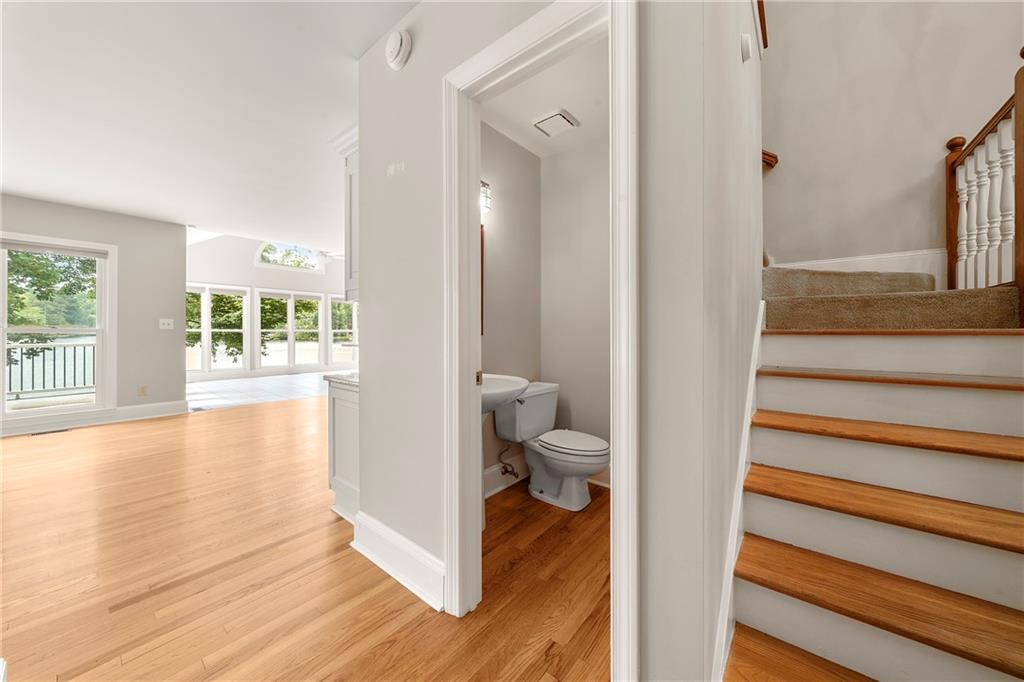 75 Spring Ridge Court Newnan, GA 30265 - Photo 33 of 75 a view of a hallway with wooden floor and a bathroom