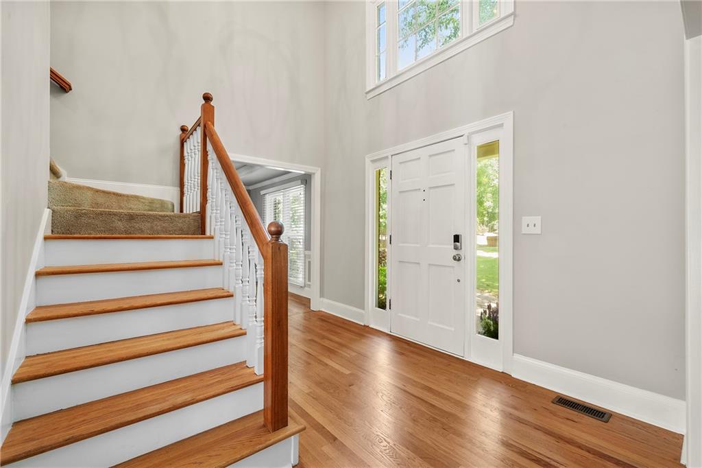 75 Spring Ridge Court Newnan, GA 30265 - Photo 35 of 75 a view of entryway with wooden floor and stairs