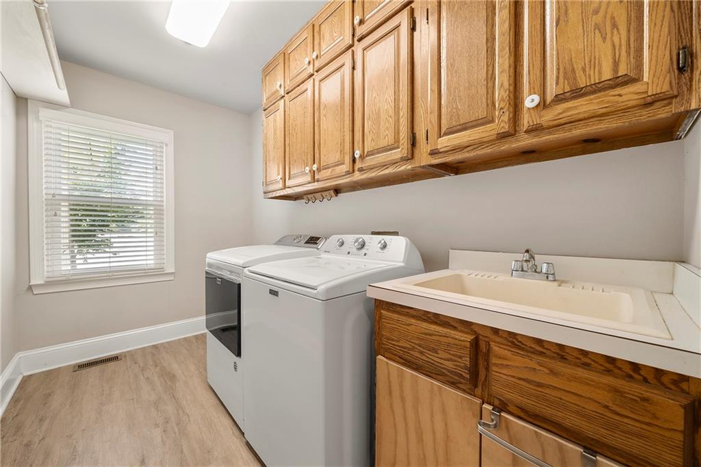 75 Spring Ridge Court Newnan, GA 30265 - Photo 37 of 75 a utility room with dryer and washer