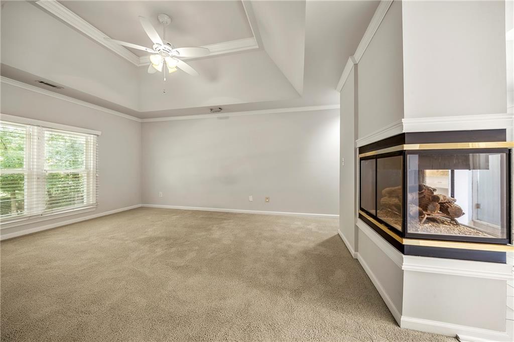 75 Spring Ridge Court Newnan, GA 30265 - Photo 40 of 75 an empty room with windows and fan