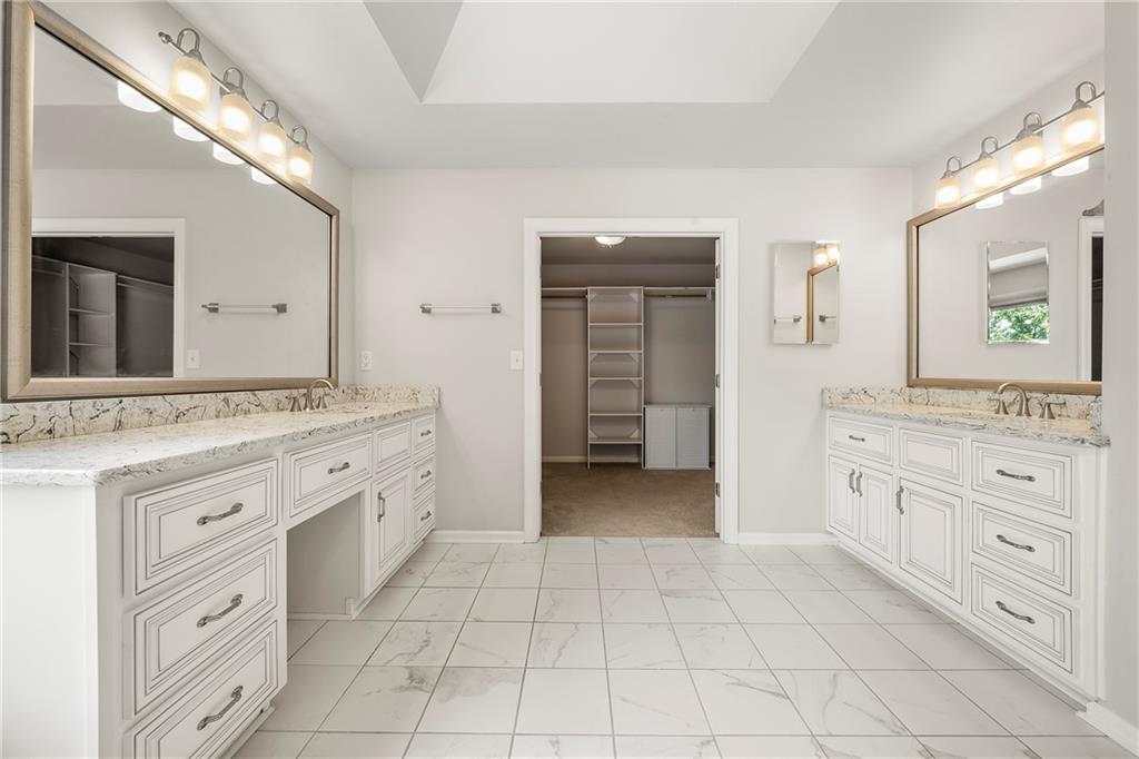 75 Spring Ridge Court Newnan, GA 30265 - Photo 47 of 75 a spacious bathroom with a granite countertop sink mirror and