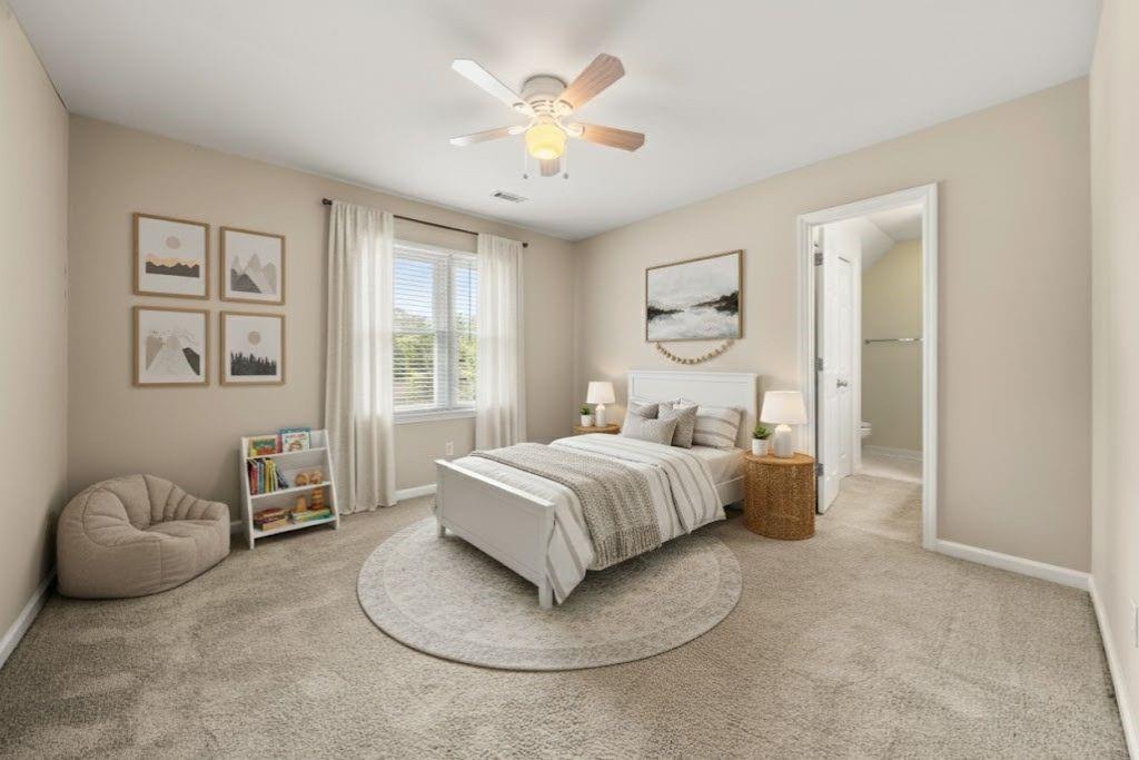 75 Spring Ridge Court Newnan, GA 30265 - Photo 51 of 75 a bedroom with a large bed and a chandelier