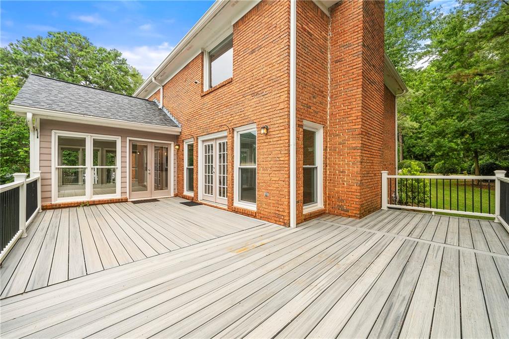 75 Spring Ridge Court Newnan, GA 30265 - Photo 62 of 75 a view of a wooden deck with a yard