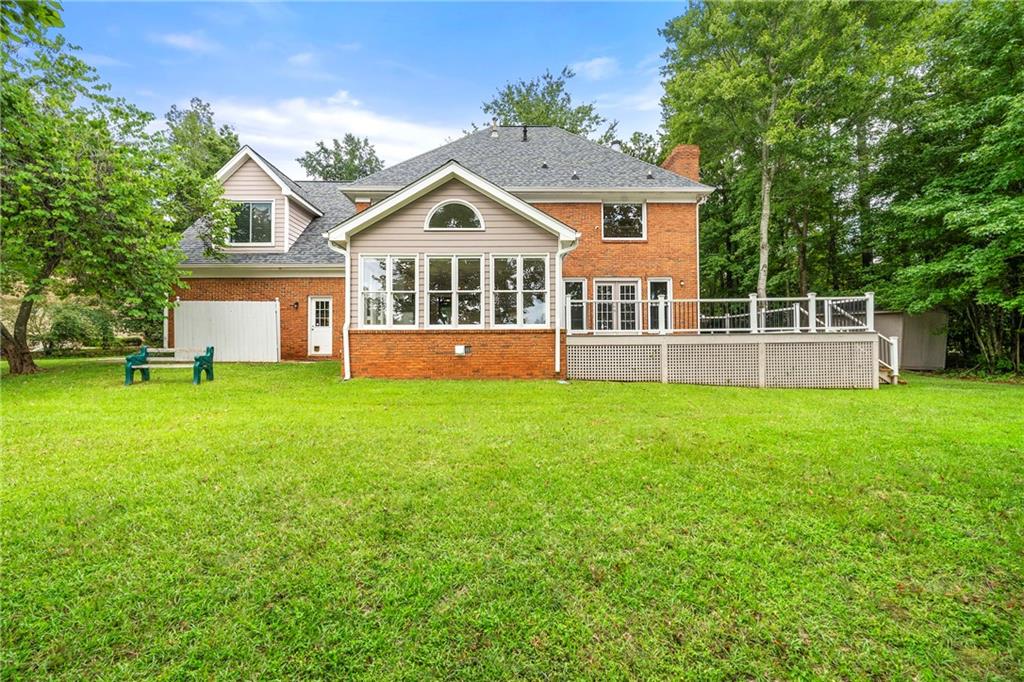 75 Spring Ridge Court Newnan, GA 30265 - Photo 67 of 75 a front view of a house with a yard and trees