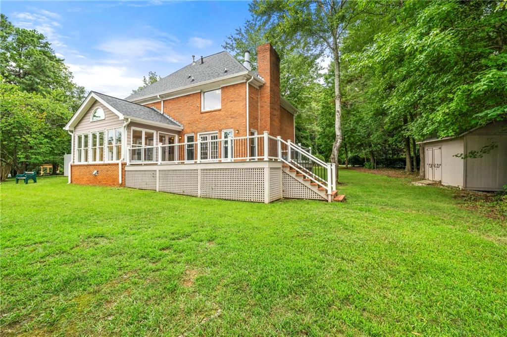 75 Spring Ridge Court Newnan, GA 30265 - Photo 68 of 75 a view of a house with backyard and garden