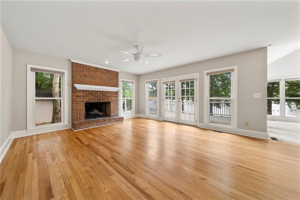 75 Spring Ridge Court Newnan, GA 30265 - Photo 10 of 75 a view of an empty room with wooden floor and a window