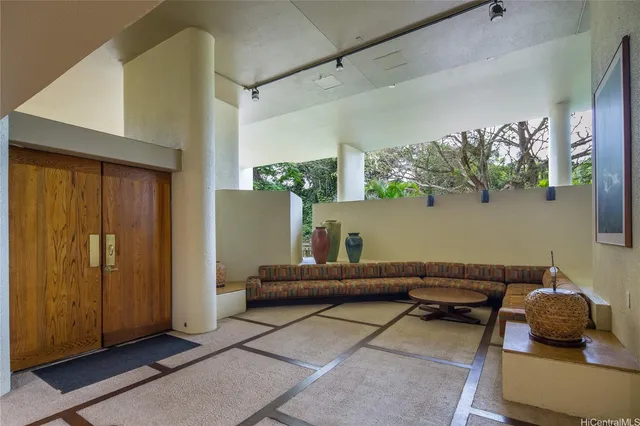 a living room with furniture and a window