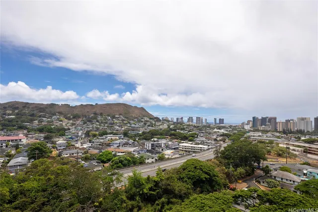 an aerial view of residential building and trees around