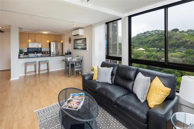 a living room with furniture and a large window