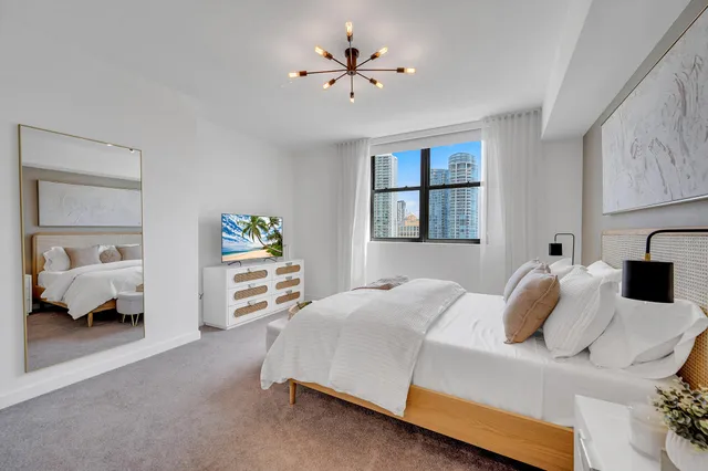 a bedroom with a bed and a couch