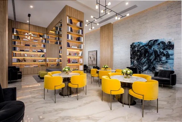 a view of a dining room with furniture and chandelier