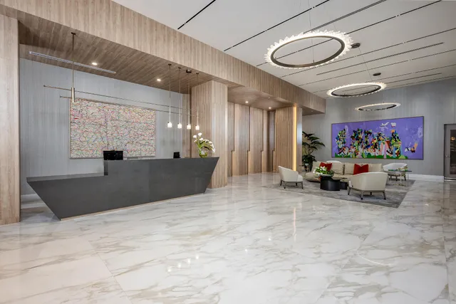 a lobby with furniture and window