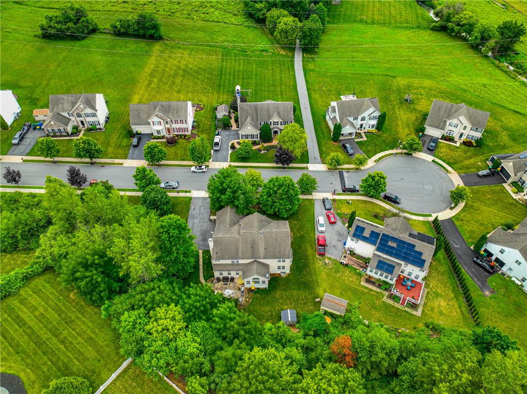 138 Clover Hollow Road Easton, PA 18045 - Photo 85 of 95 An aerial perspective reveals a residential enclave nestled between verdant fields and natural woodlands.