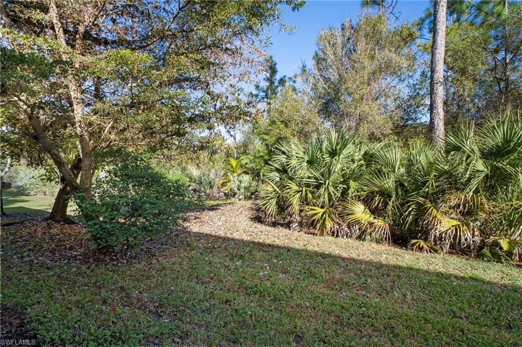 19501 Bowring Park Road, Unit 102 Fort Myers, FL 33967 - Photo 33 of 33 a view of a yard with a tree