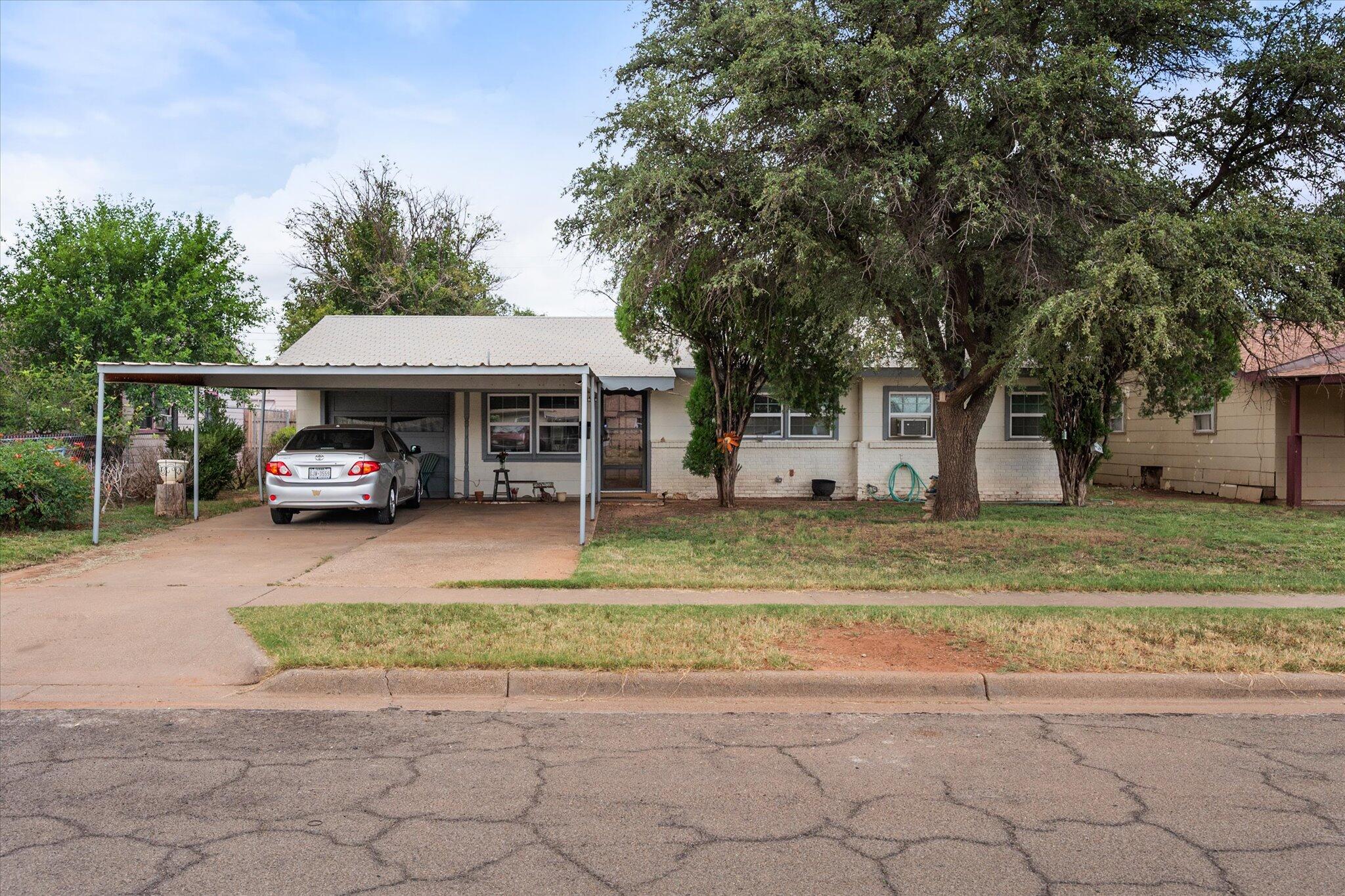 3407 East Colgate Street Lubbock, TX 79403 - Photo 1 of 22 a car parked in front of a house