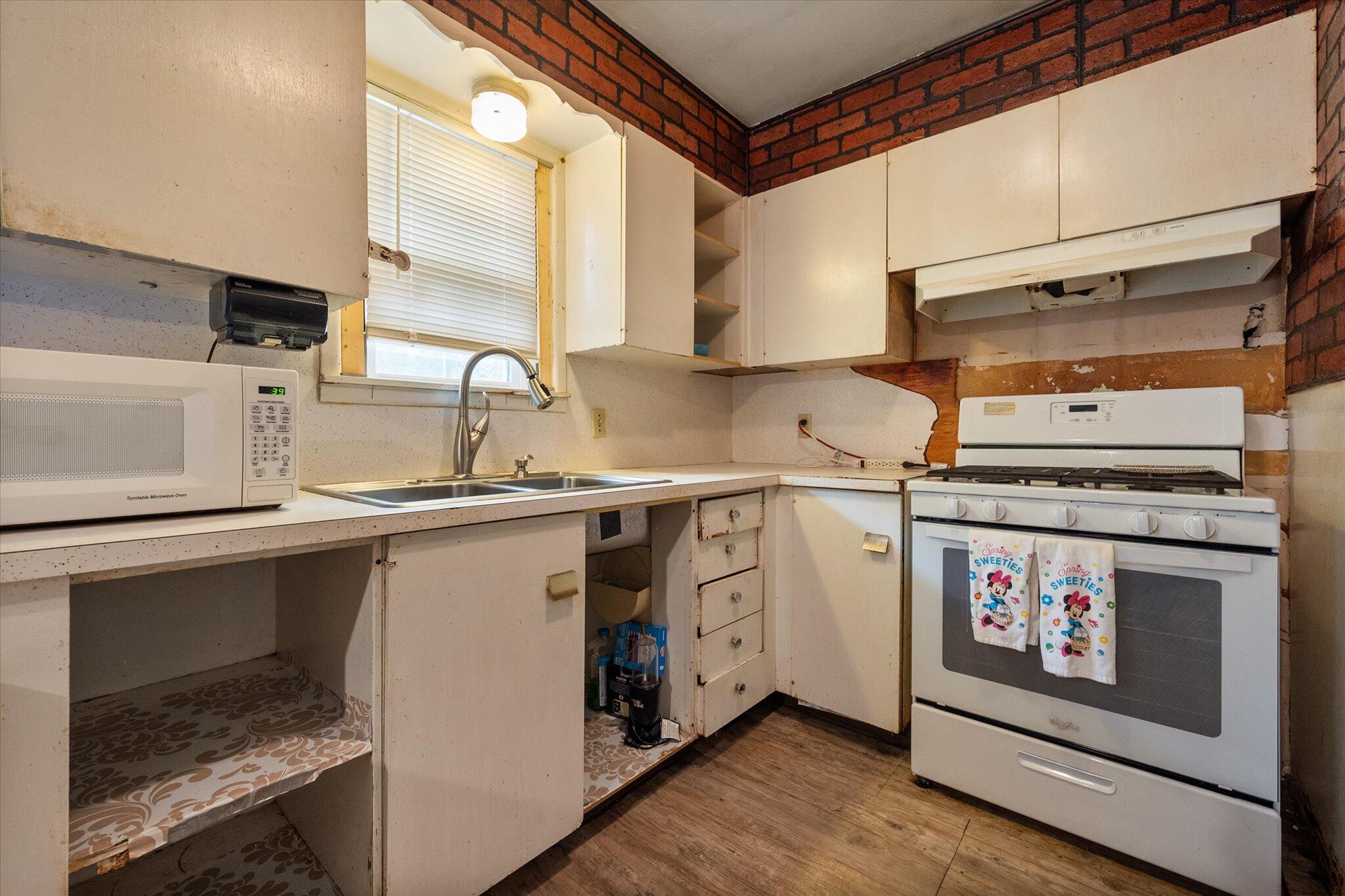 3407 East Colgate Street Lubbock, TX 79403 - Photo 13 of 22 a kitchen with a stove and a sink