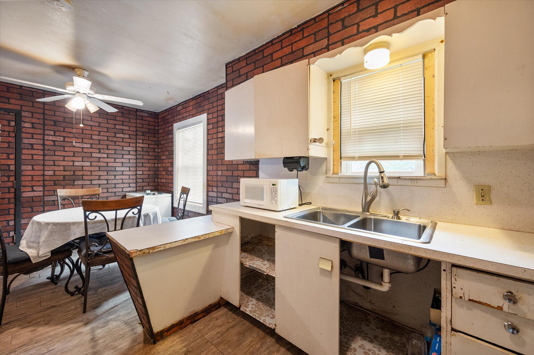 3407 East Colgate Street Lubbock, TX 79403 - Photo 15 of 22 a view of a kitchen with a sink and cabinets