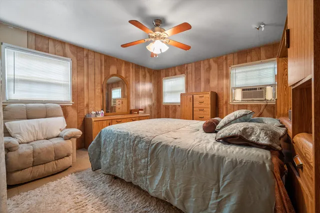 a bed room with a bed and a couch